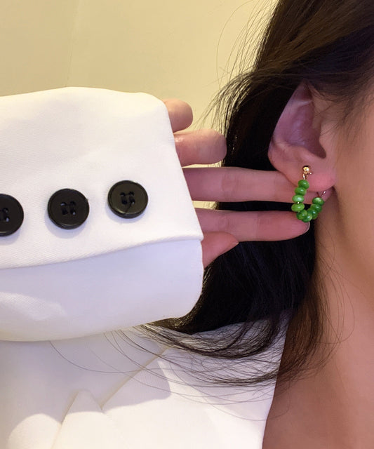 Elegantes pendientes de aro con piedra de ojo de gato dorada en plata de ley verde