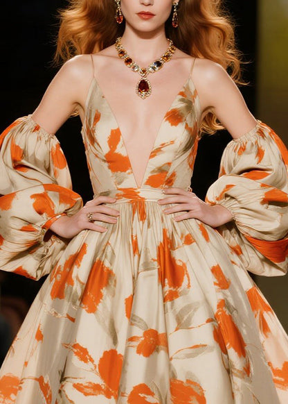 Elegante Kleider mit orangefarbenem Print und extra weitem Saum sowie Laternenärmeln