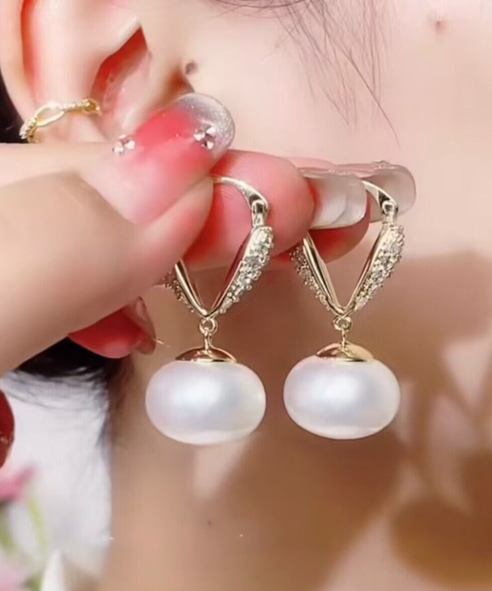 Elegantes pendientes colgantes de cobre blanco dorado con perla y circonitas