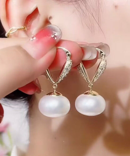 Elegantes pendientes colgantes de cobre blanco dorado con perla y circonitas