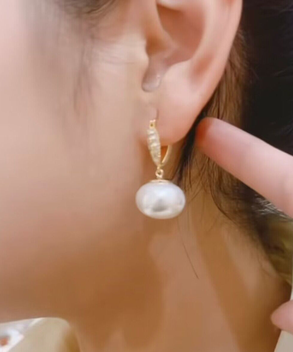 Elegantes pendientes colgantes de cobre blanco dorado con perla y circonitas
