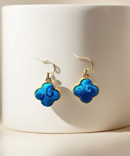 Ohrhänger im chinesischen Stil aus schwarzgrüner Kupferlegierung in Form eines vierblättrigen Kleeblatts und einer Kalebasse