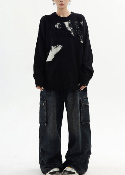 Suéter negro oversize con parches rotos y clase para invierno