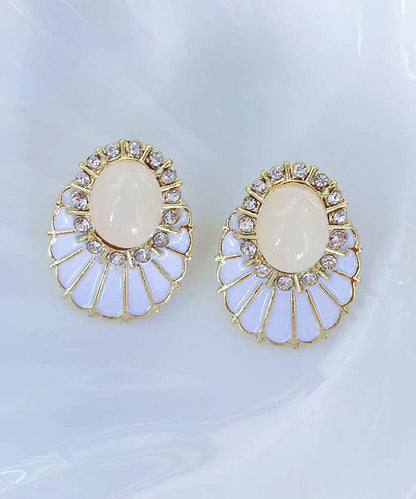 Pendientes elegantes de aleación de cobre blanco con circonitas y perlas en forma de abanico.