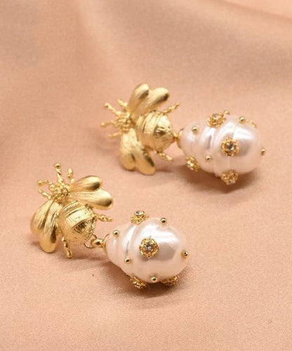 Pendientes colgantes con forma de abeja y perla de circonitas y cobre dorado