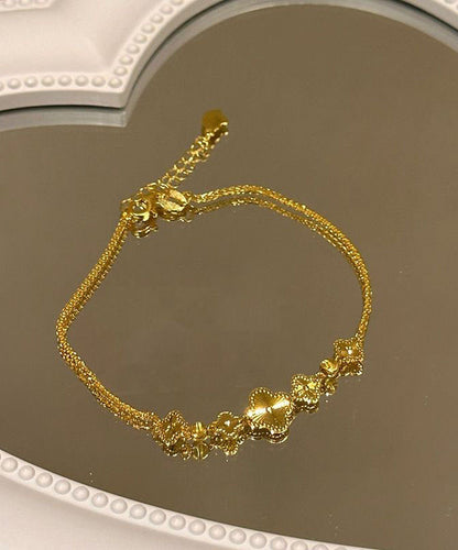 Pulsera elegante con dije de trébol de cuatro hojas y plata de ley dorada