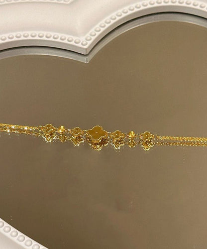 Pulsera elegante con dije de trébol de cuatro hojas y plata de ley dorada