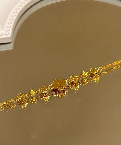 Pulsera elegante con dije de trébol de cuatro hojas y plata de ley dorada
