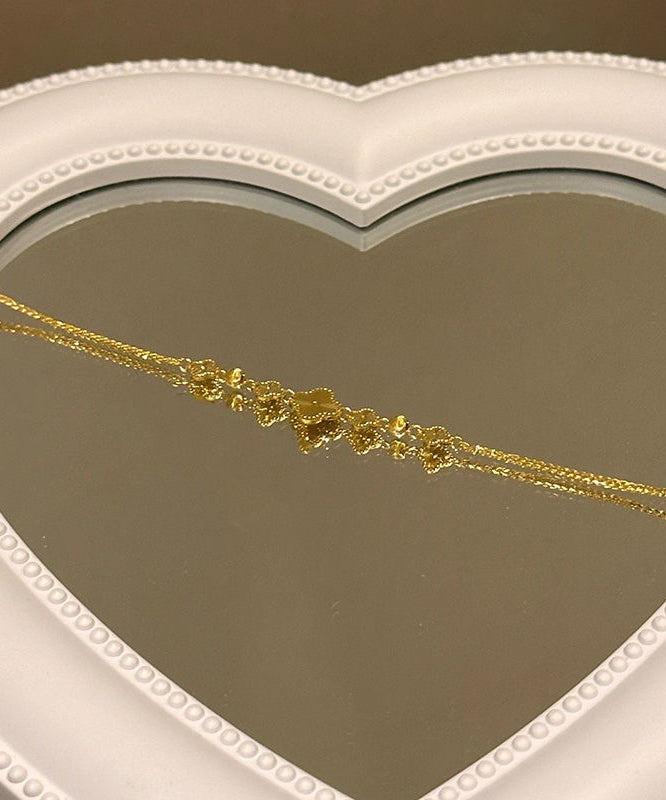Pulsera elegante con dije de trébol de cuatro hojas y plata de ley dorada