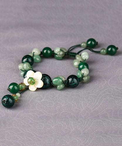 Pulsera elegante con dije de flor de concha y esmalte de ágata verde y jade verde