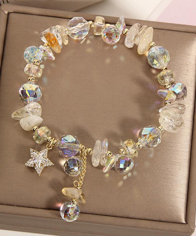 Pulsera elegante de plata de ley con dije de circonitas y cristales dorados en color morado claro