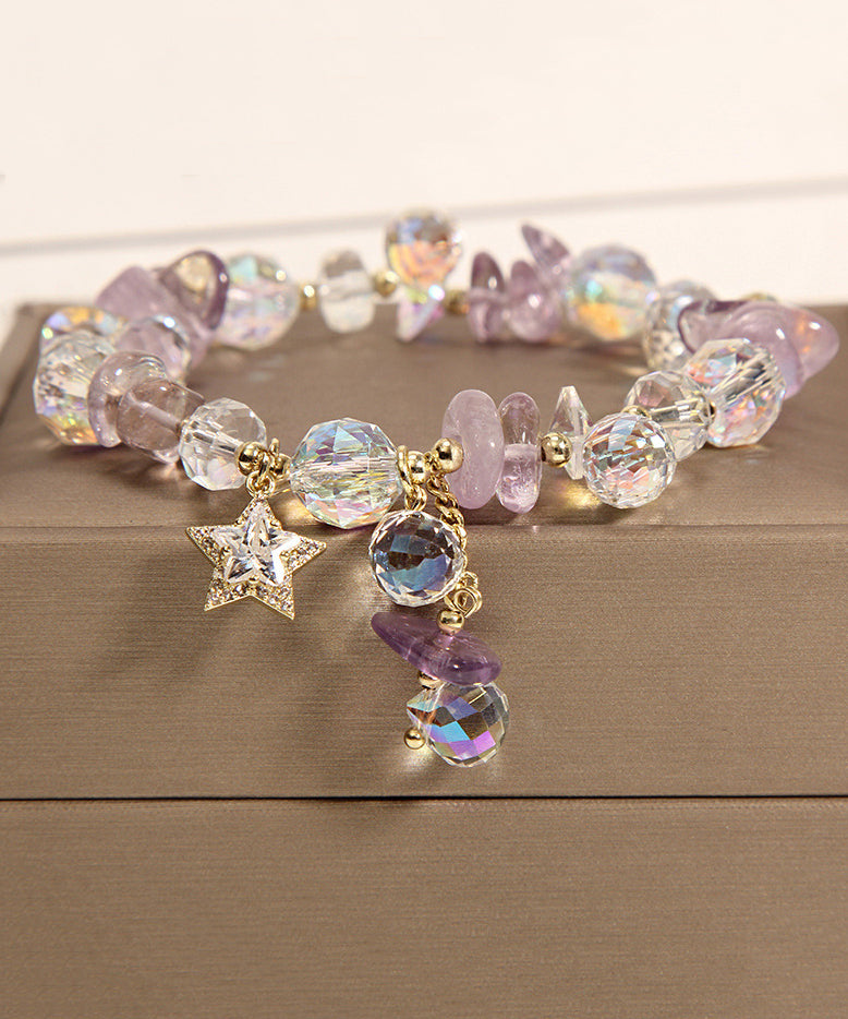 Pulsera elegante de plata de ley con dije de circonitas y cristales dorados en color morado claro