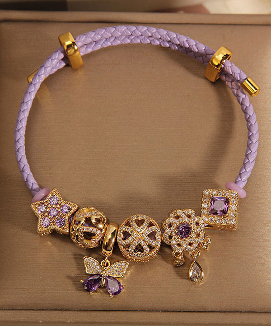 Pulsera elegante de plata de ley morada con circonitas doradas, mariposa, estrella y gota de agua