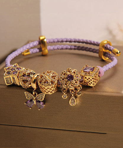 Pulsera elegante de plata de ley morada con circonitas doradas, mariposa, estrella y gota de agua