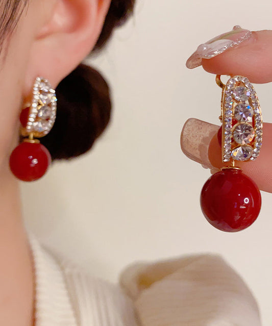 Pendientes elegantes con bola de circonita y perla dorada de cobre rojo