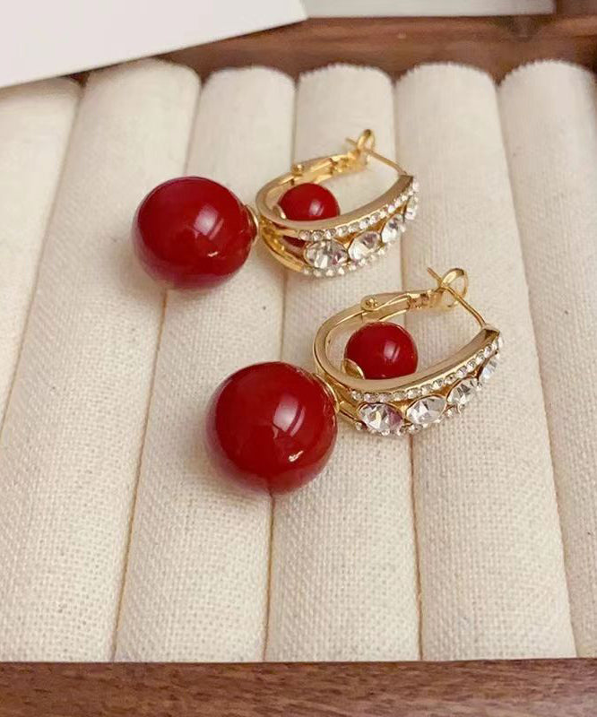 Pendientes elegantes con bola de circonita y perla dorada de cobre rojo