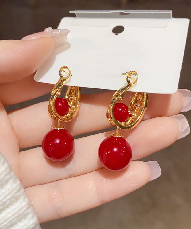 Pendientes elegantes con bola de circonita y perla dorada de cobre rojo