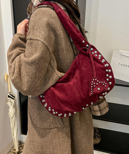 Bolso de mano elegante y duradero de piel sintética con remaches rojos