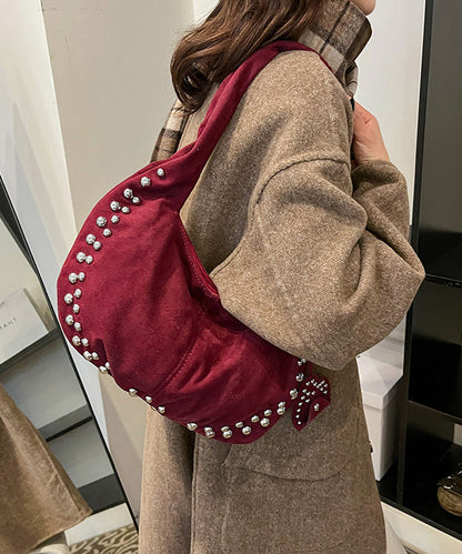 Bolso de mano elegante y duradero de piel sintética con remaches rojos