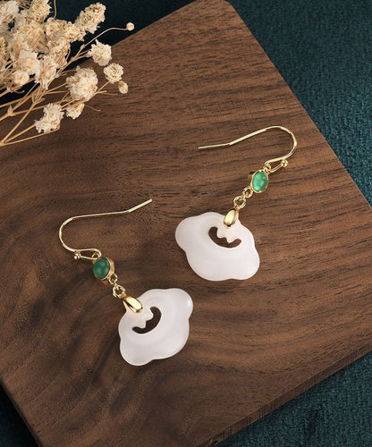 Elegantes pendientes colgantes de jade con gemas incrustadas en oro blanco antiguo