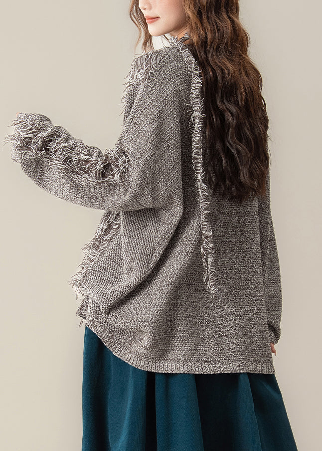 Strickpullover mit V-Ausschnitt und Fransen an der Kaffeeloch-Optik