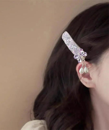 Niedliche blaue Haarnadel mit Schleife aus Legierung, Zirkonperle und Quaste, verziert mit einer Zirkonperle und einer Perle.