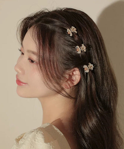 Niedliche Haarnadel aus Goldlegierung und Perle mit vier Kombinationsmöglichkeiten