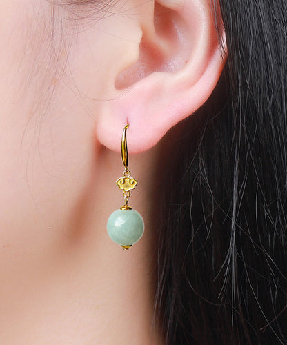 Lindos aretes colgantes de jade dorado en plata de ley verde claro