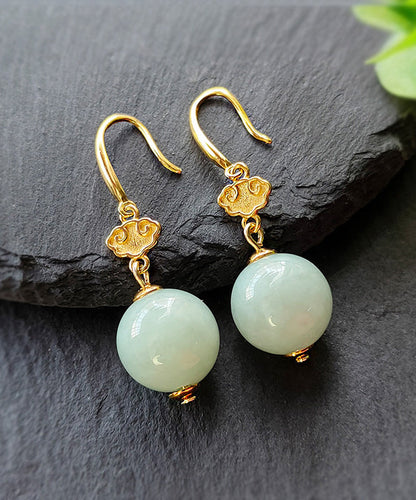 Lindos aretes colgantes de jade dorado en plata de ley verde claro