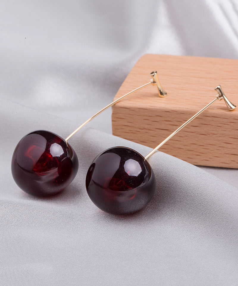 Lindos aretes colgantes de cereza acrílica de aleación naranja