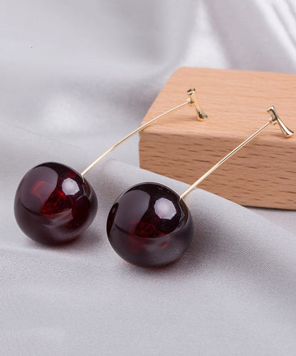 Lindos aretes colgantes de cereza acrílica de aleación naranja