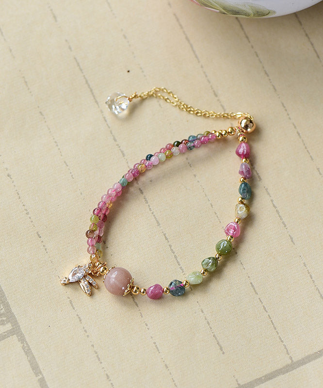 Bonita pulsera con dije de cristal de jade y circonita en oro rosa de 14 quilates