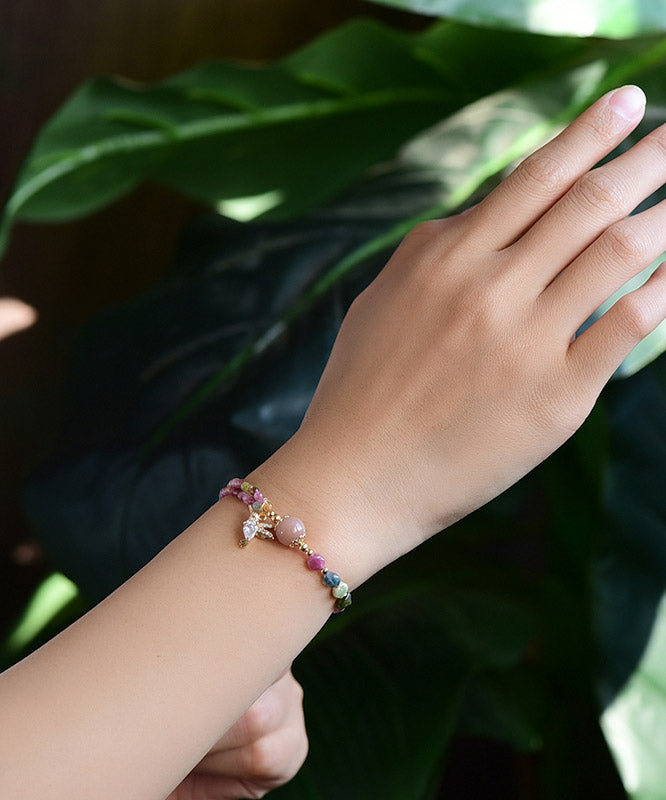 Bonita pulsera con dije de cristal de jade y circonita en oro rosa de 14 quilates