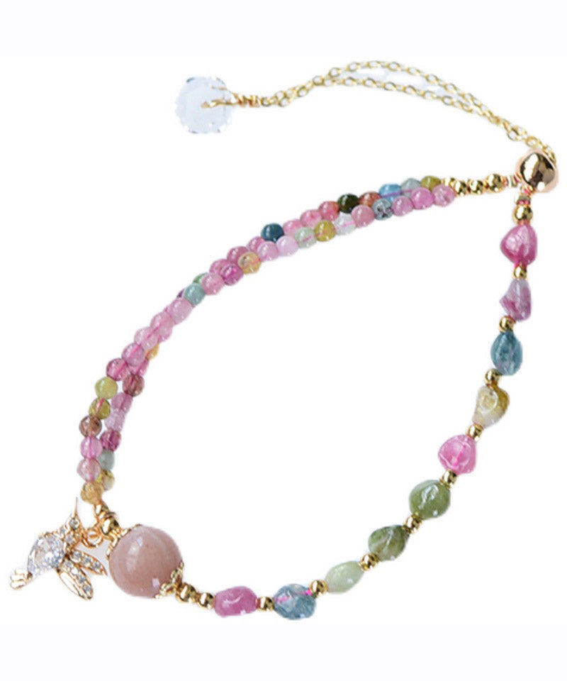 Bonita pulsera con dije de cristal de jade y circonita en oro rosa de 14 quilates