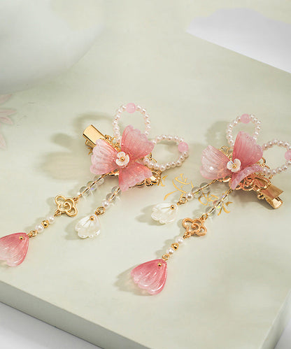 Un par de horquillas con borlas esmaltadas de color perla de aleación de cobre rosa