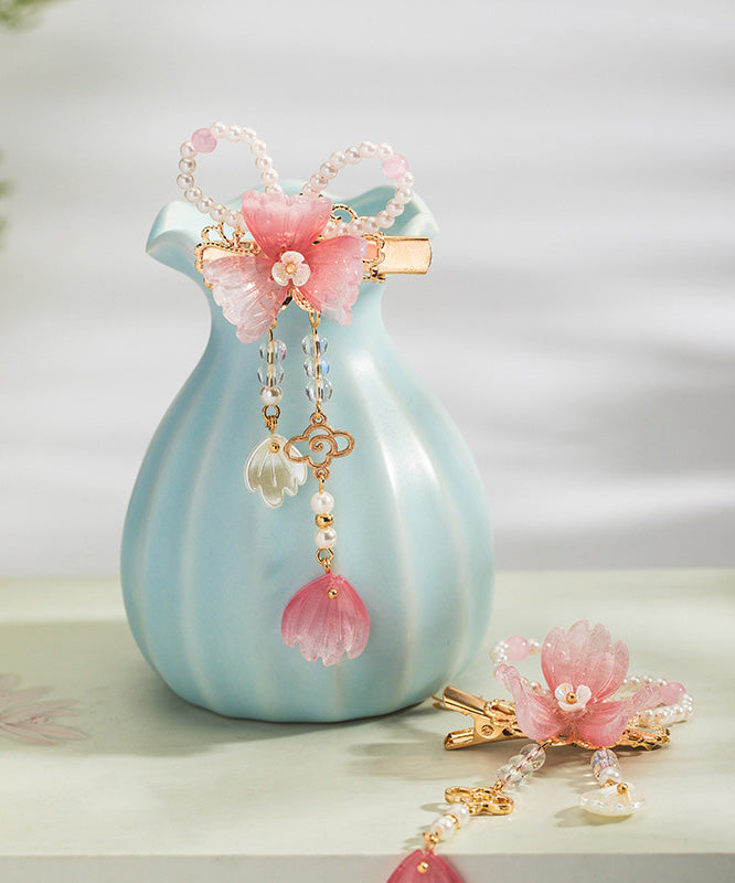 Un par de horquillas con borlas esmaltadas de color perla de aleación de cobre rosa