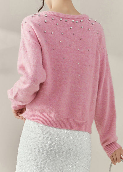 Suéter de punto de algodón acogedor con cuentas y cuello redondo en color rosa para primavera