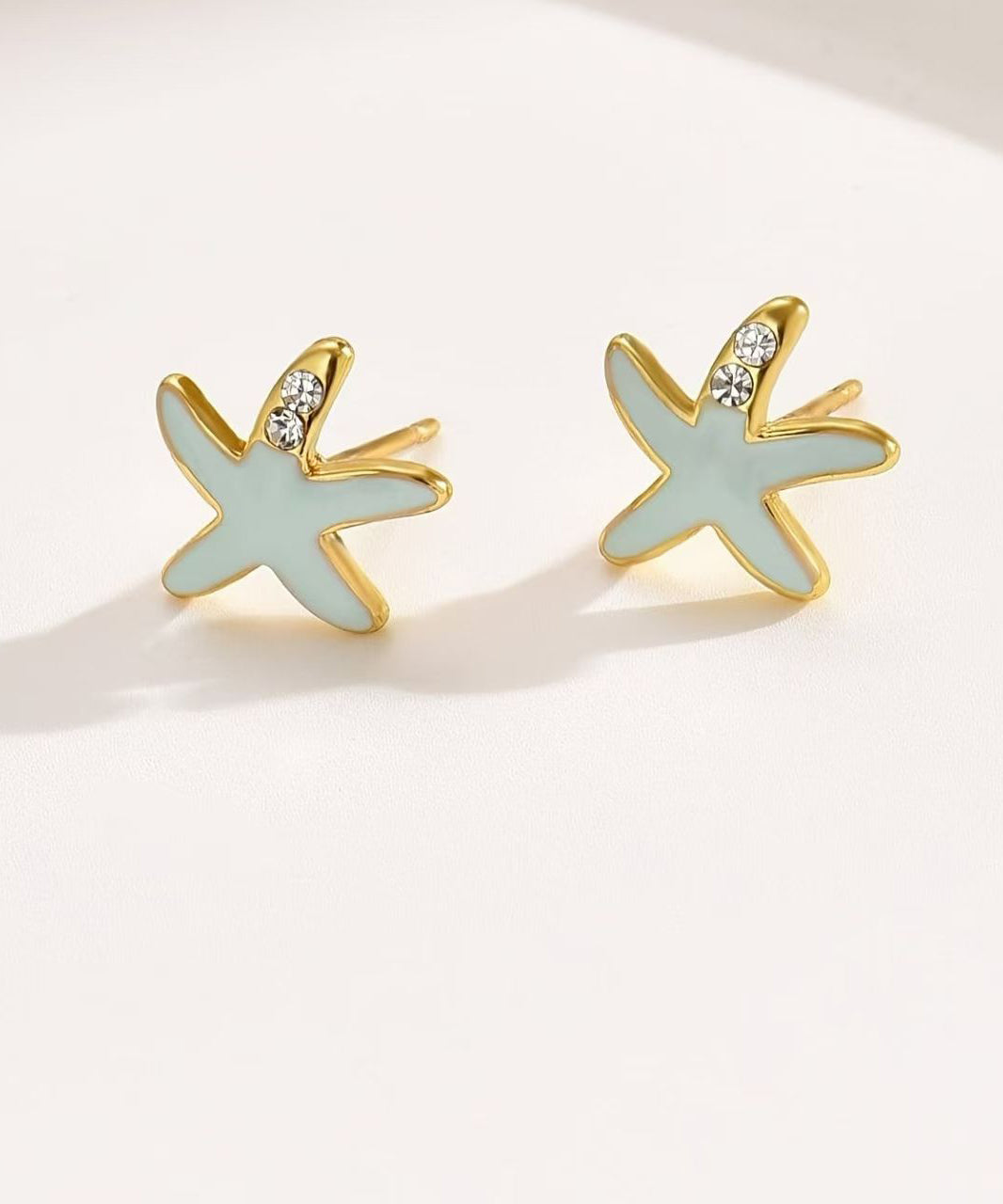 Pendientes de estrella de mar con circonitas de aleación de cobre azul hechos a mano