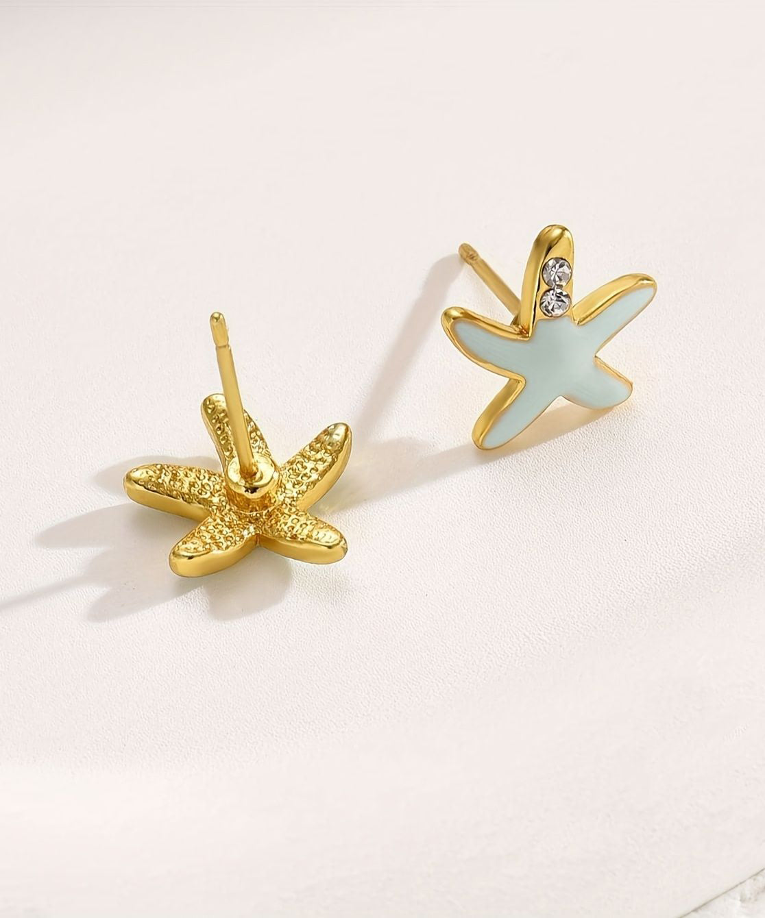 Pendientes de estrella de mar con circonitas de aleación de cobre azul hechos a mano
