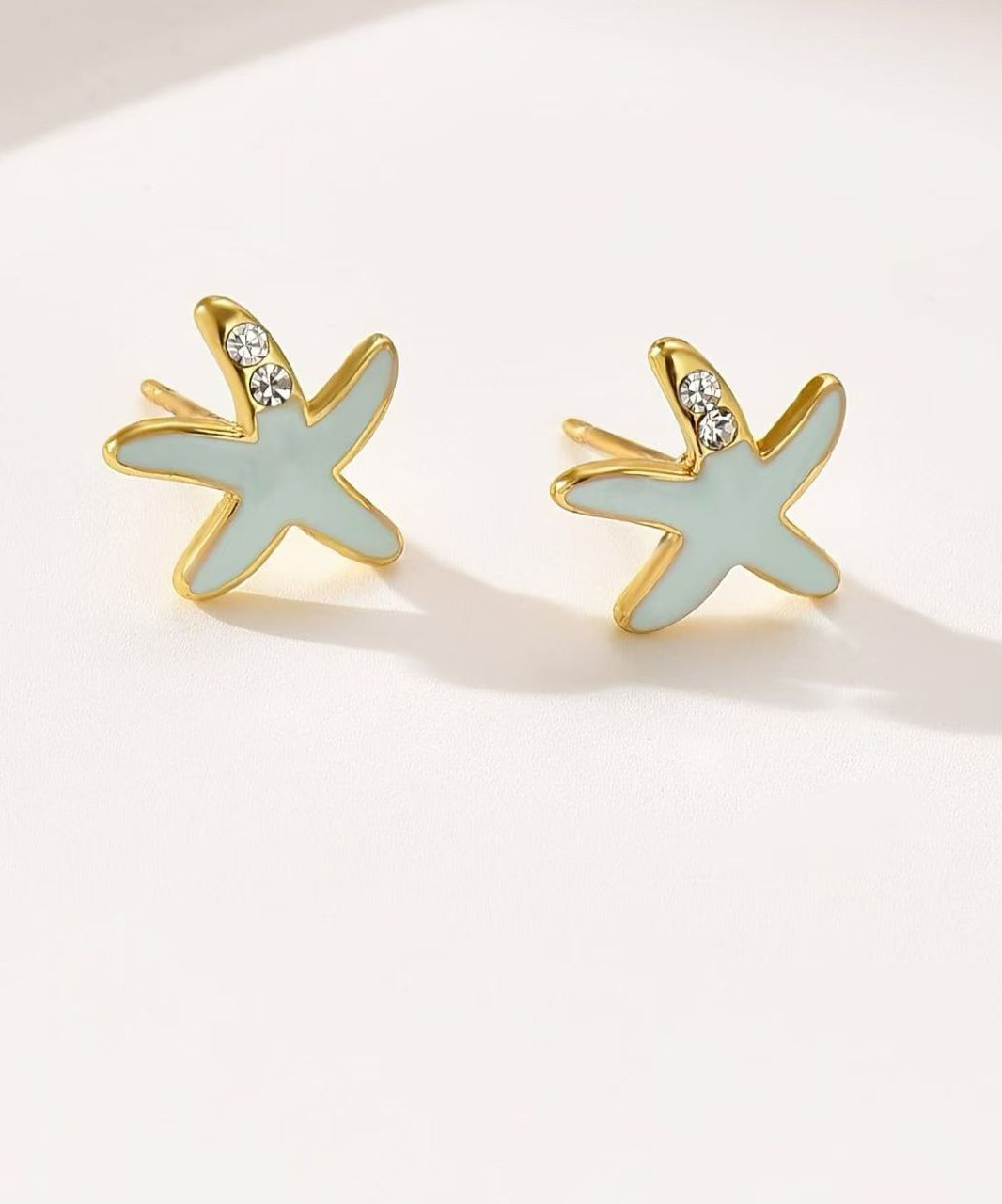 Pendientes de estrella de mar con circonitas de aleación de cobre azul hechos a mano