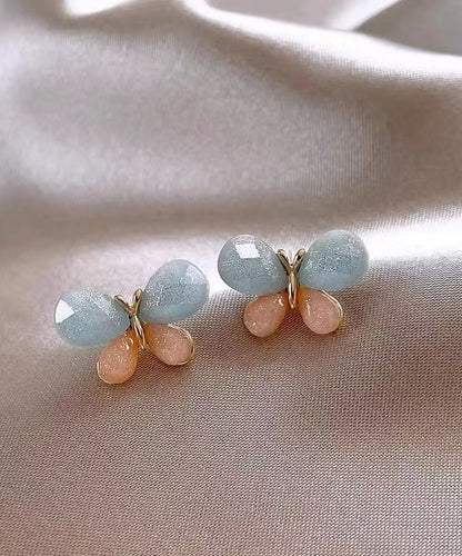 Pendientes de mariposa con diseño de bloques de color y dorado de cobre