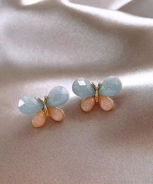Pendientes de mariposa con diseño de bloques de color y dorado de cobre