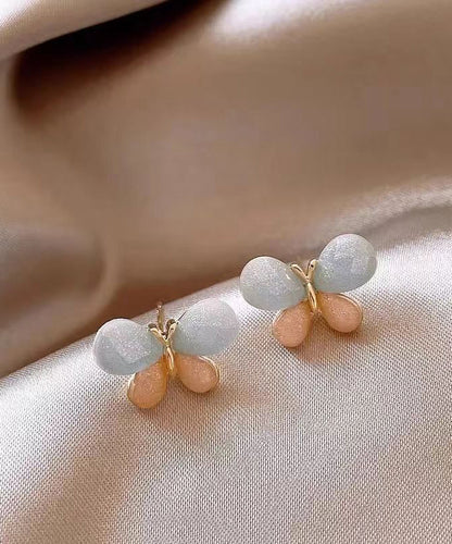 Pendientes de mariposa con diseño de bloques de color y dorado de cobre