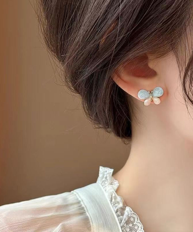 Pendientes de mariposa con diseño de bloques de color y dorado de cobre