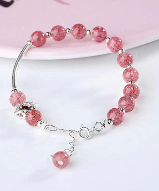 Elegante pulsera de plata de ley con dije de granate y cristal de fresa en color rojo agua