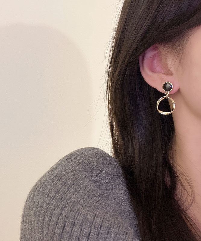 Elegantes pendientes circulares de aleación de plata de ley negra con gotas de aceite.