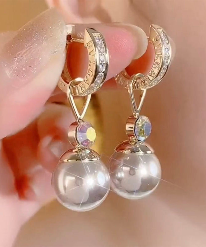 Elegantes pendientes colgantes de perlas y circonitas doradas en plata de ley Cham pagne