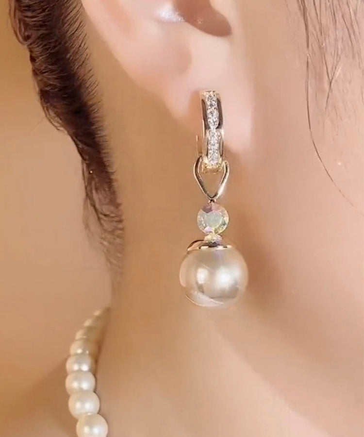 Elegantes pendientes colgantes de perlas y circonitas doradas en plata de ley Cham pagne