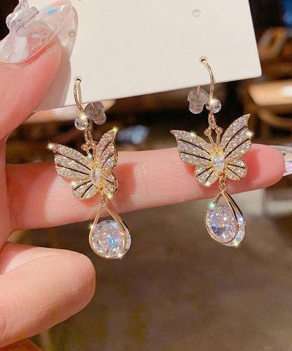 Elegantes pendientes de mariposa con cristales de circonita y aleación de oro.