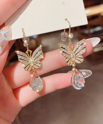 Elegantes pendientes de mariposa con cristales de circonita y aleación de oro.